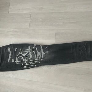 AMIRI Black Distressed Skinny Jeans